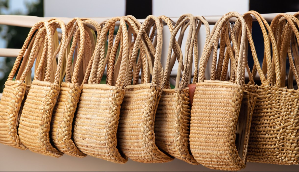 selection of straw bags in different colors and styles