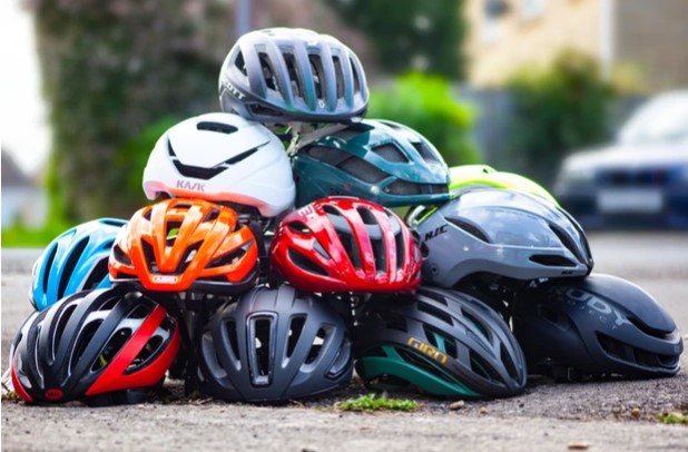 selection of aero bike helmets in different colors and styles