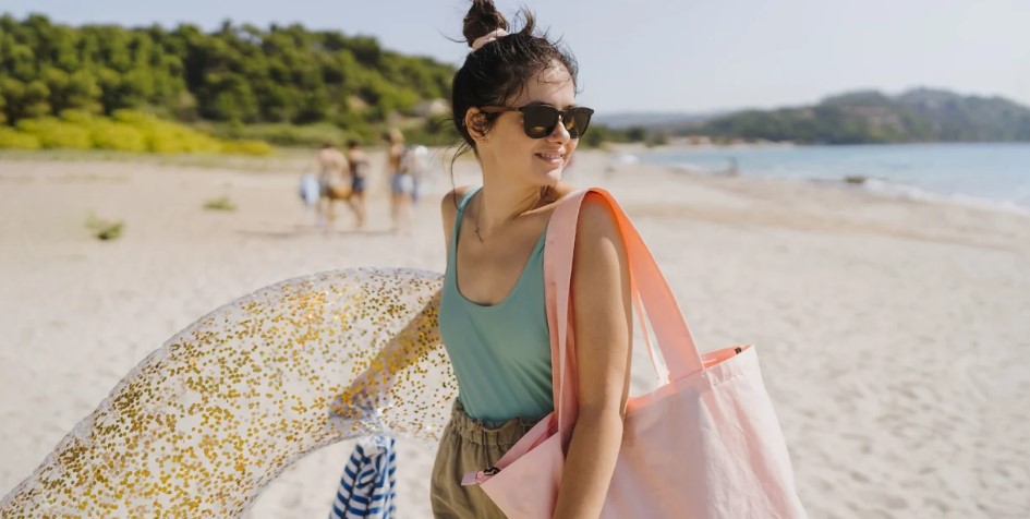 selection of designer beach bags in different colors and styles