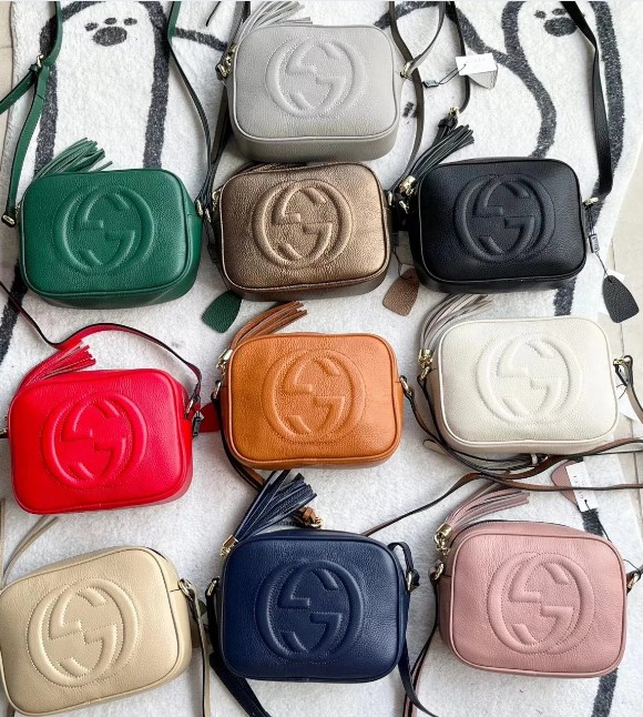 selection of designer camera bags in different colors and styles